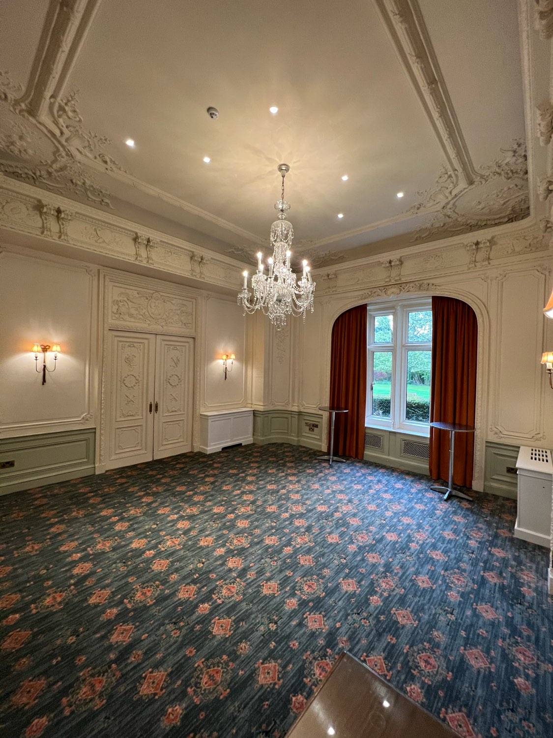 Elegant meeting room with chandelier at Warren House Hotel, perfect for events and gatherings.