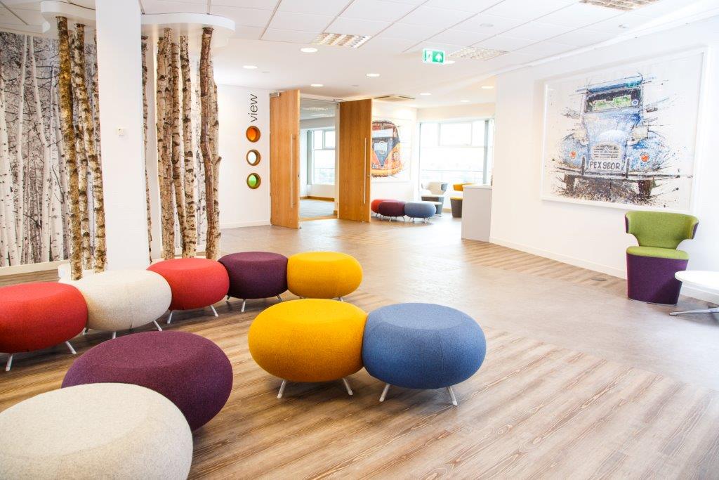 Modern meeting space in Leeds with colorful seating for workshops and brainstorming.