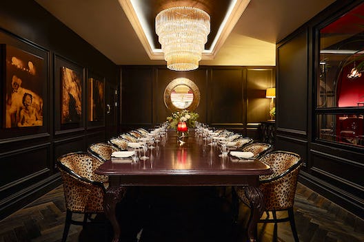 Elegant private dining room with polished table for corporate meetings and exclusive events.