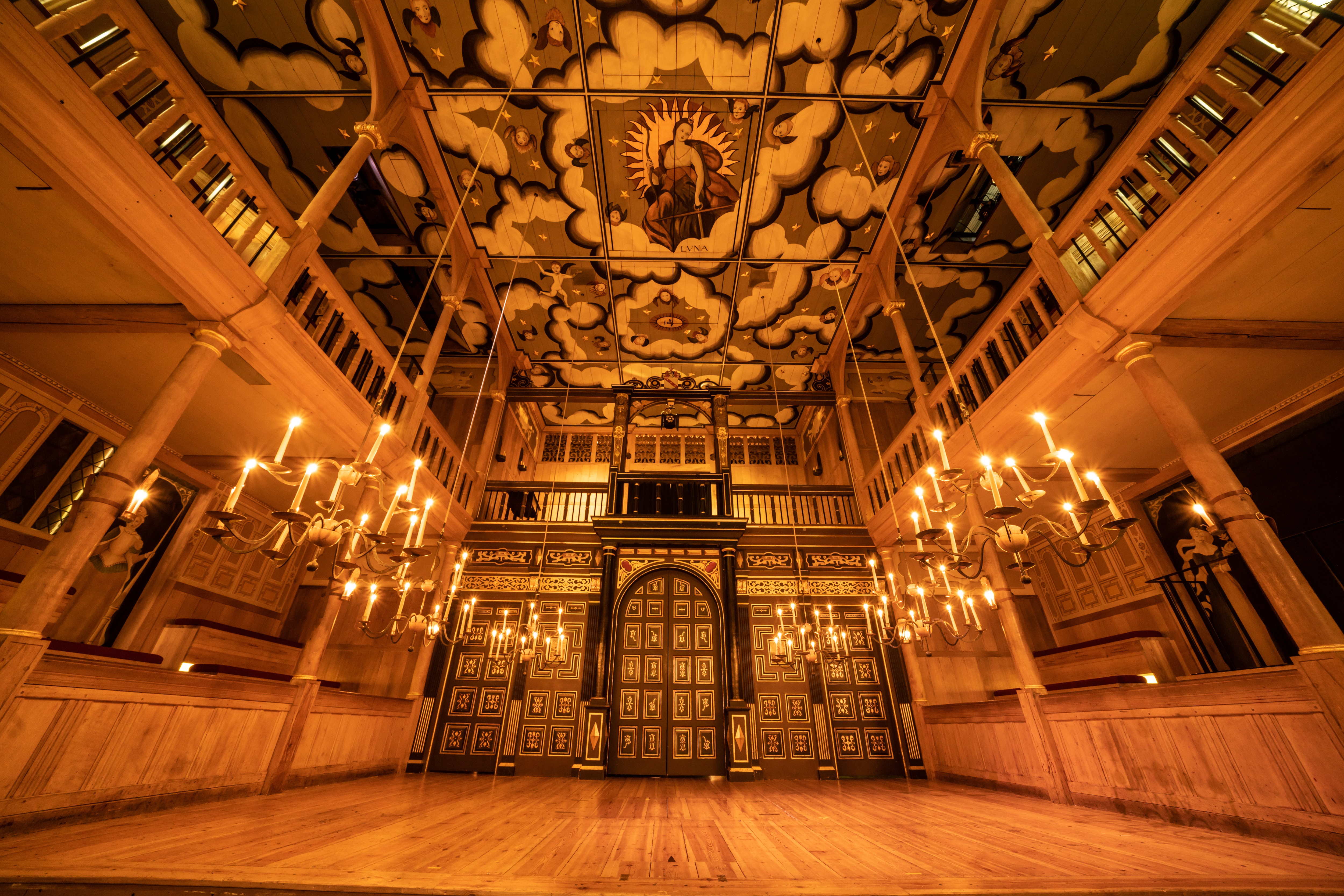 Sam Wanamaker Theatre with ornate ceiling, ideal for upscale events and performances.