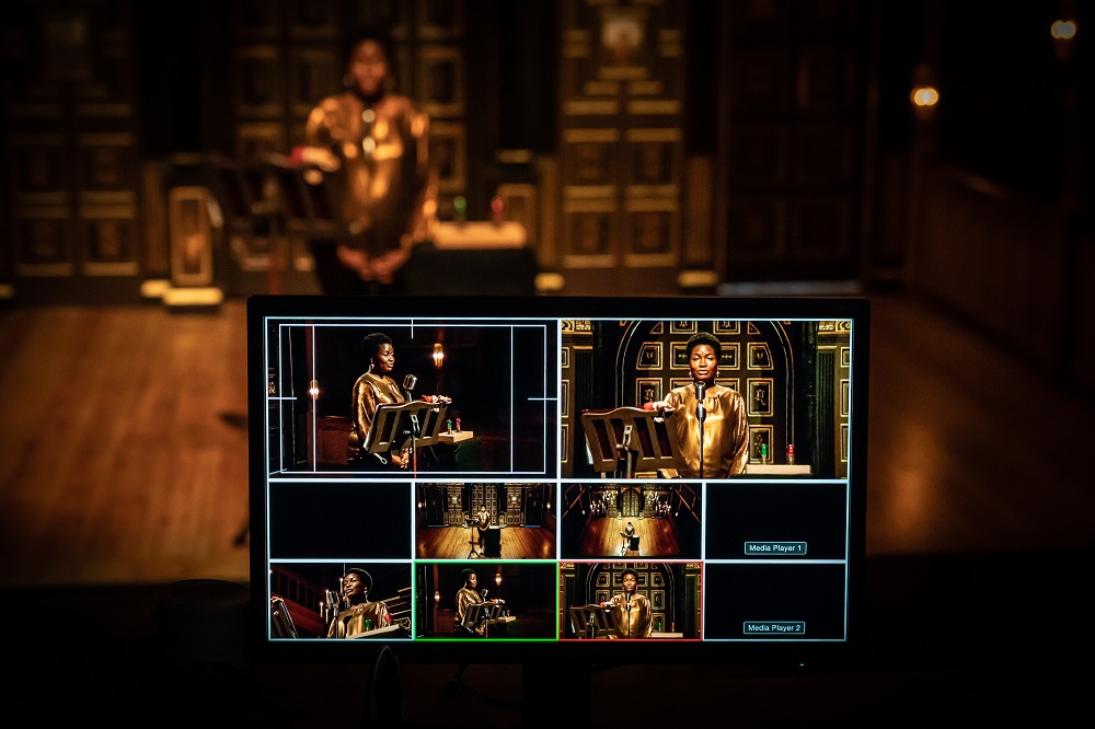 Sam Wanamaker Theatre event setup with speaker, professional lighting, and technology.