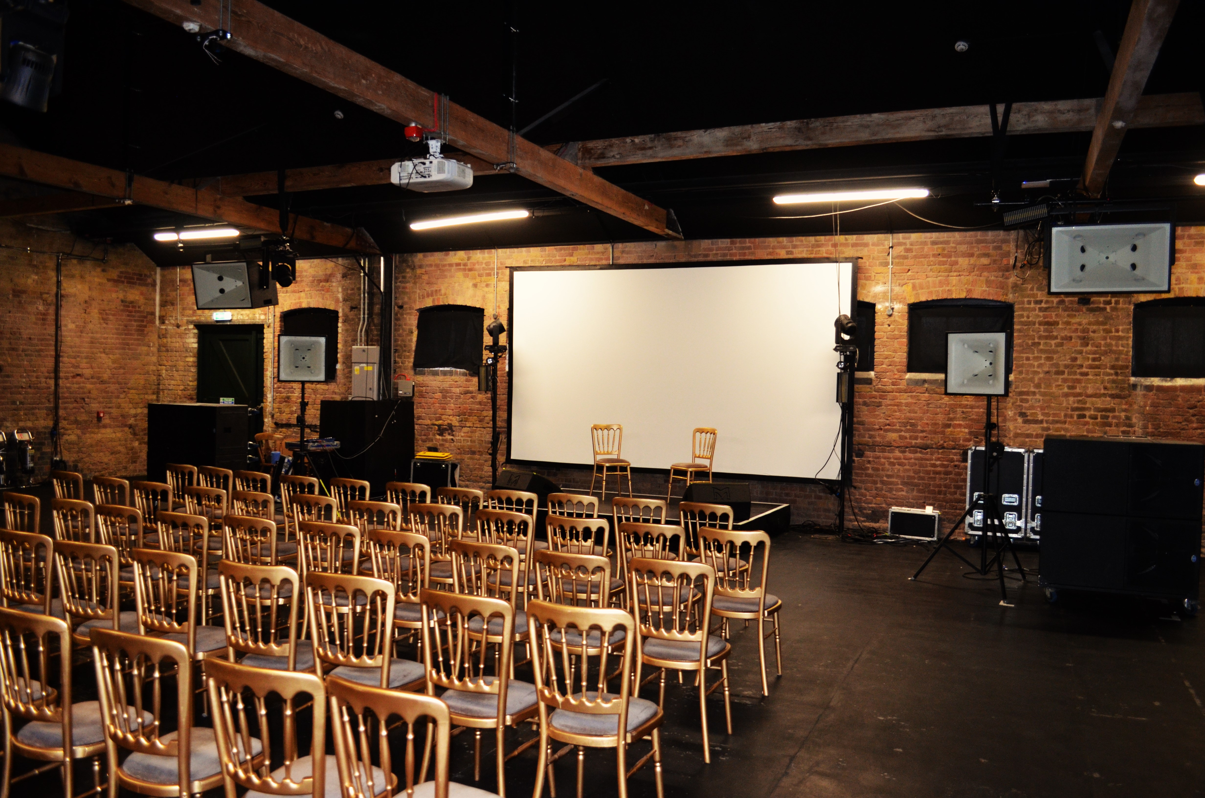 Versatile event space in The Vanguard, Camden, set for a seminar with multimedia setup.