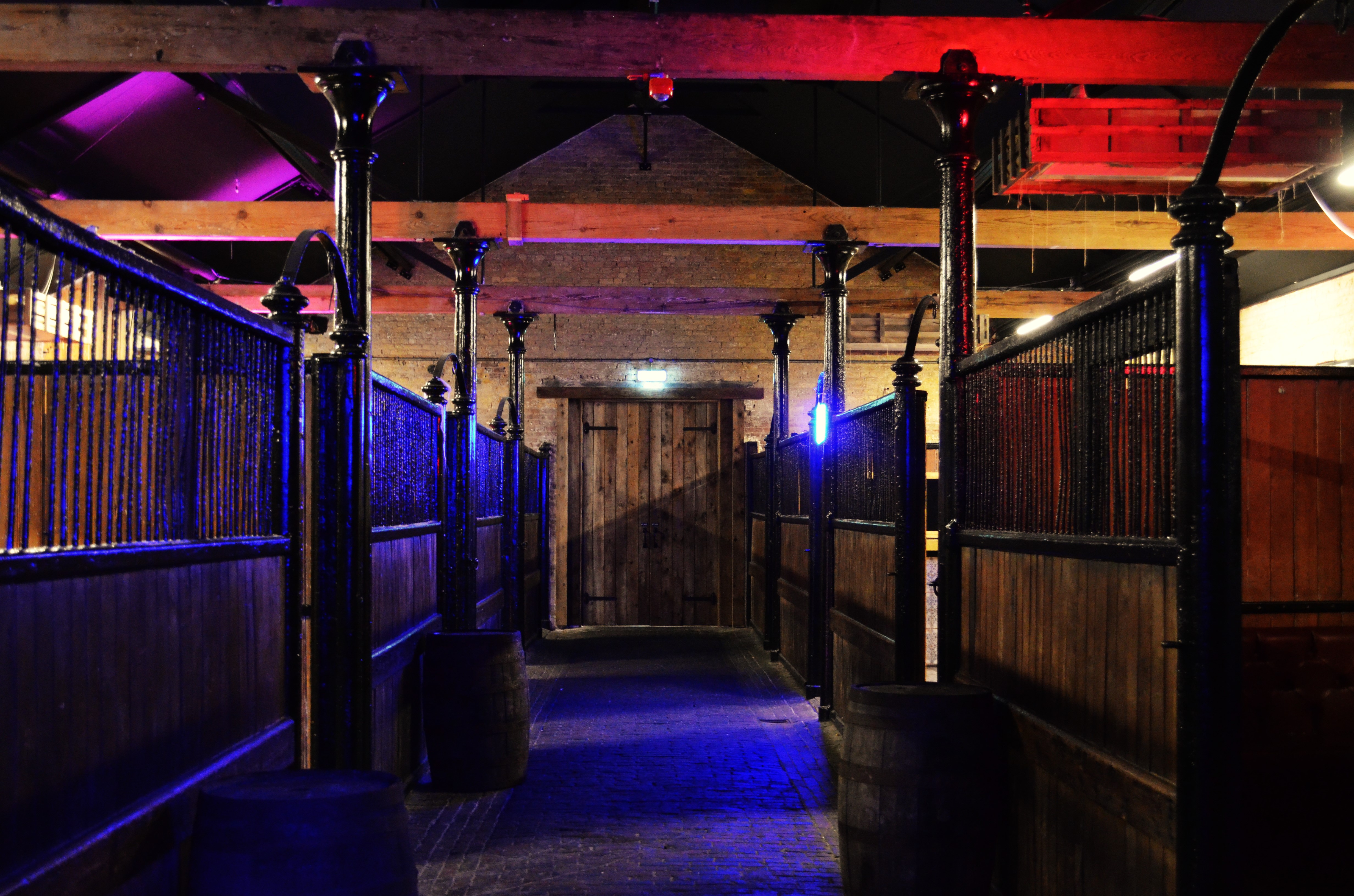 Industrial venue with exposed beams, perfect for networking events and private gatherings.