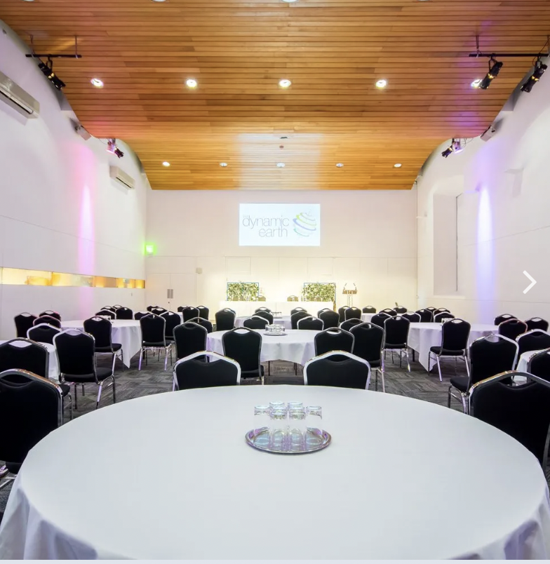 BIOSPHERE event space with round tables, ideal for corporate meetings and conferences.