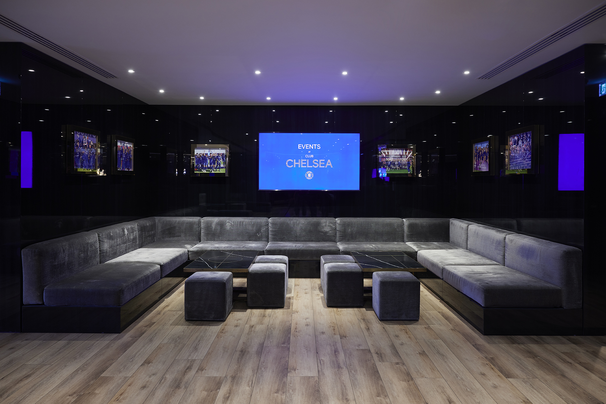 Modern Directors Lounge at Chelsea FC, featuring plush seating for events and meetings.