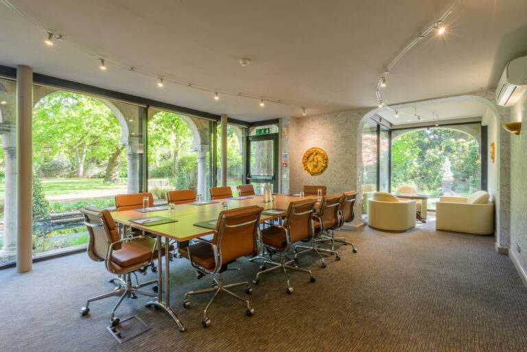 Rose Room at Warren House Hotel, bright meeting space with large conference table.