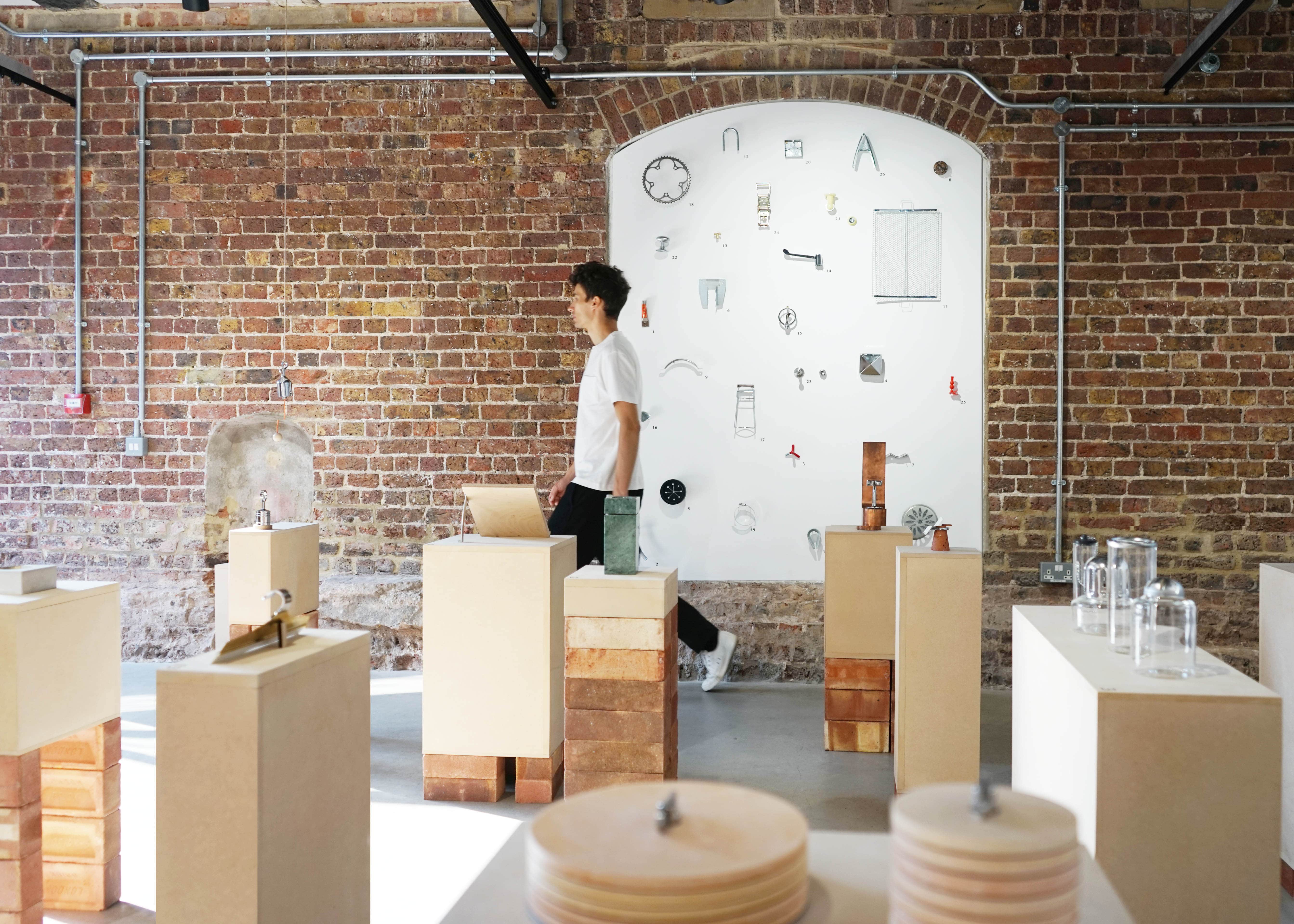 Modern minimalist event space with exposed brick, ideal for exhibitions and product launches.