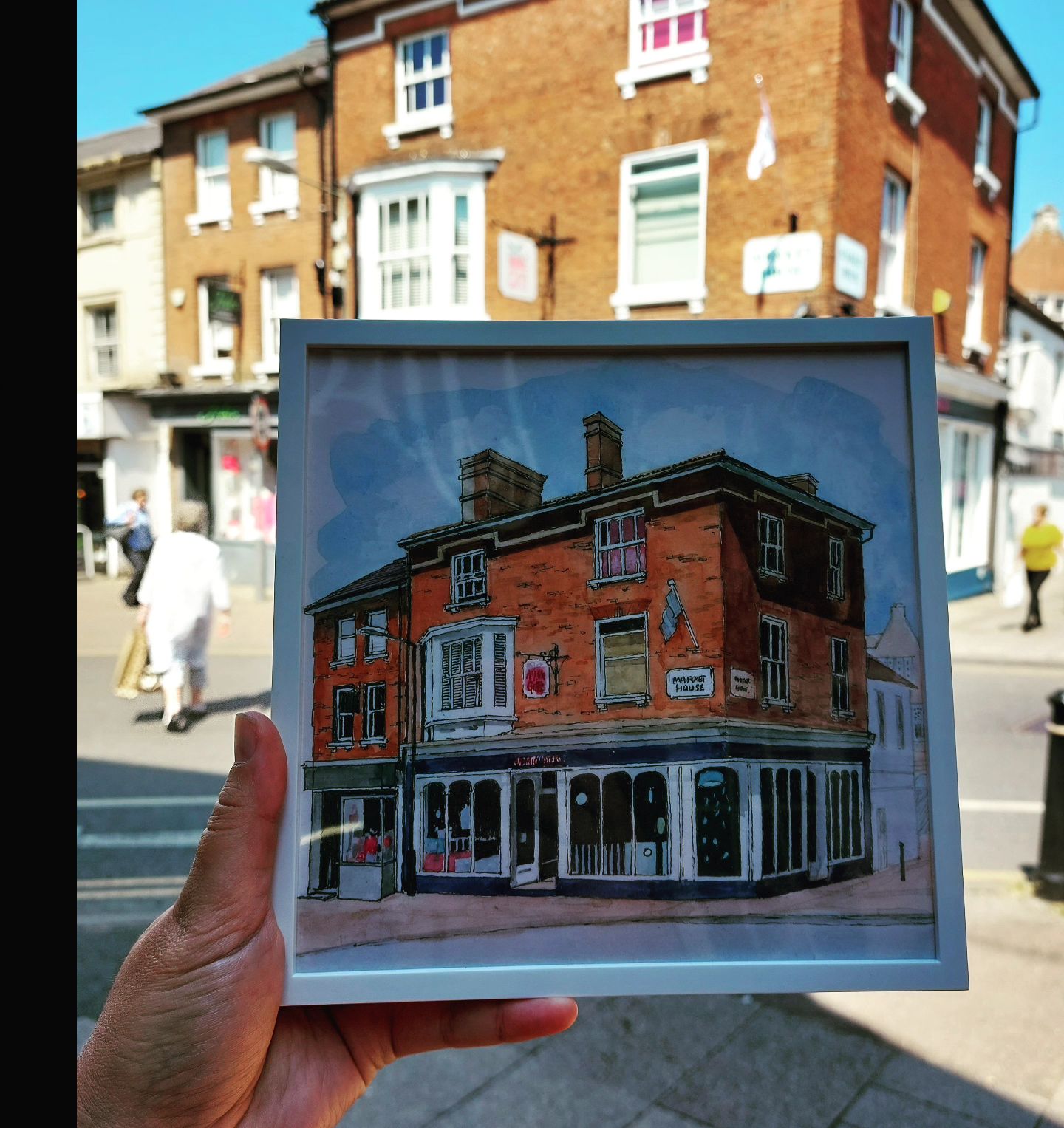 Artistic brick building held in hand, ideal for events and community gatherings.