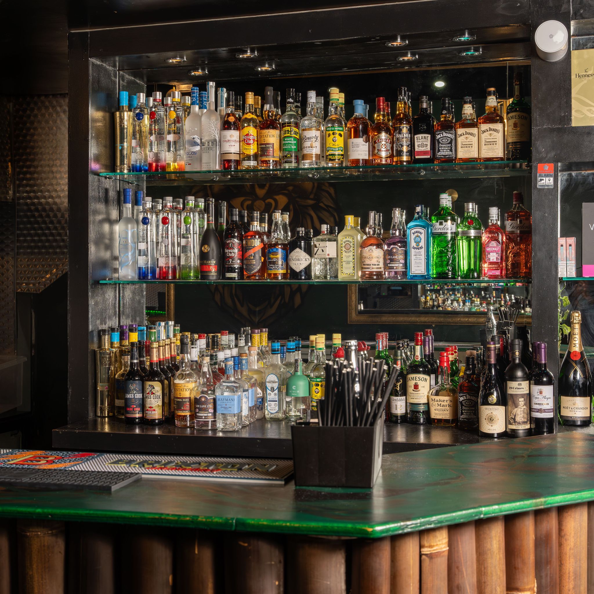 Well-stocked bar at Jungle Bar & Grill, perfect for events and signature cocktails.