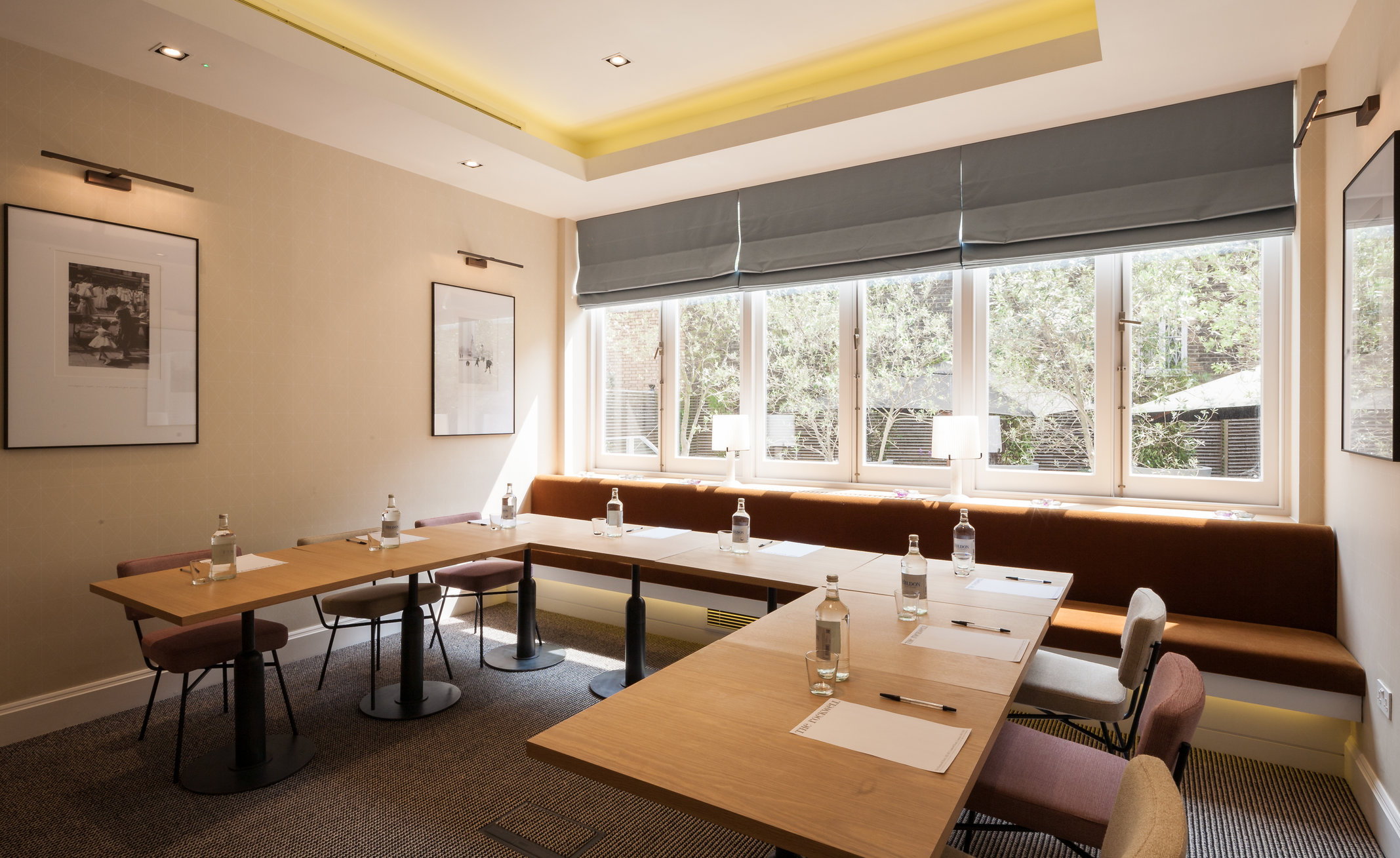 Modern meeting room with natural light, perfect for workshops and strategy sessions.