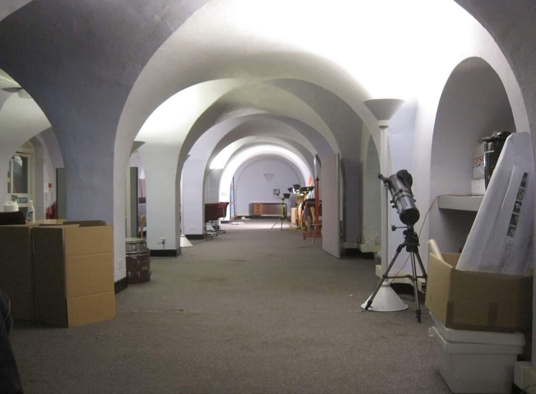 Spacious arched corridor in Pepys Community Hub, ideal for events and meetings.