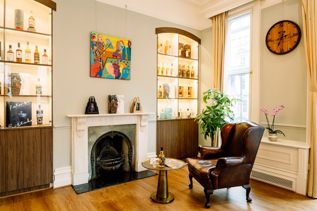 Stylish lounge with warm wood tones, ideal for networking events and informal meetings.