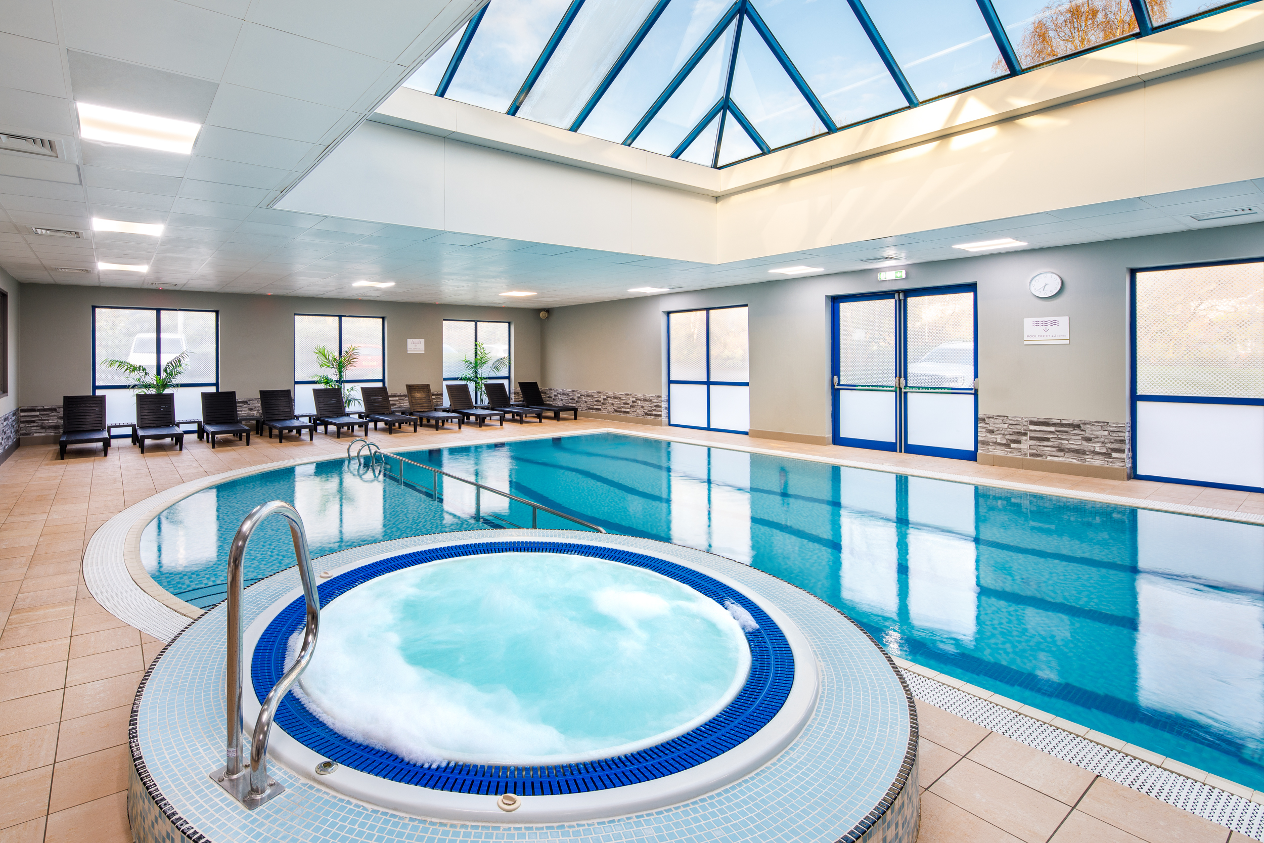 Mercure Birmingham West Hotel indoor pool with hot tub, perfect for wellness retreats and events.