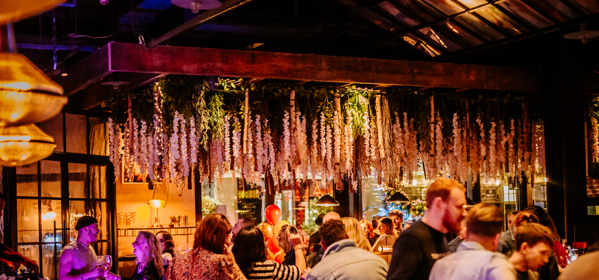 Vibrant event space with floral decor for networking and social gatherings in The Gun London.