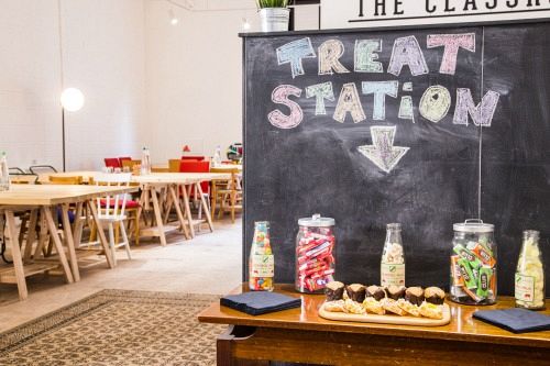 Vibrant treat station with colorful candy jars in thestudio Manchester event space.