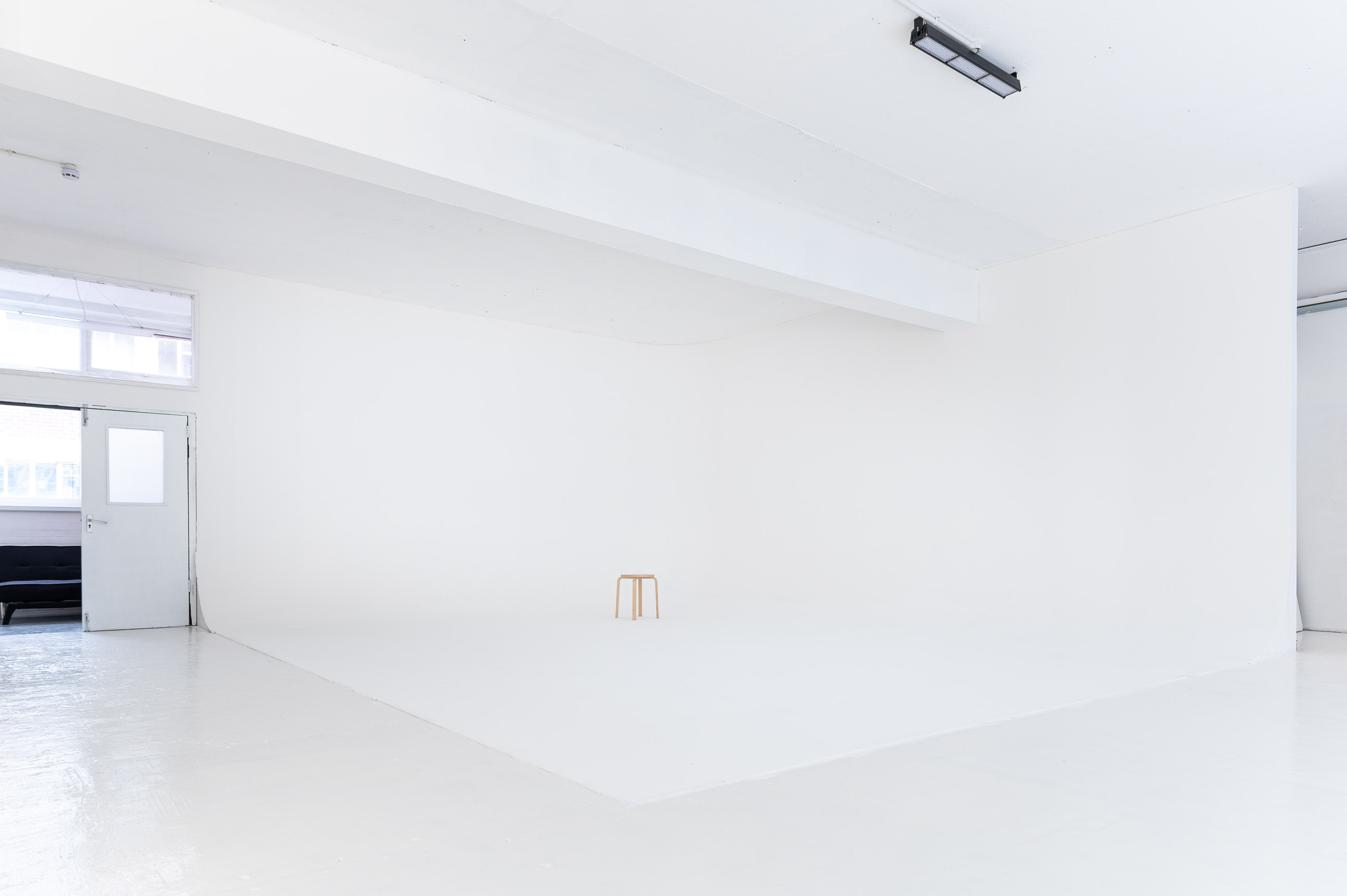 Minimalist event space in Studio 2, perfect for presentations and workshops.