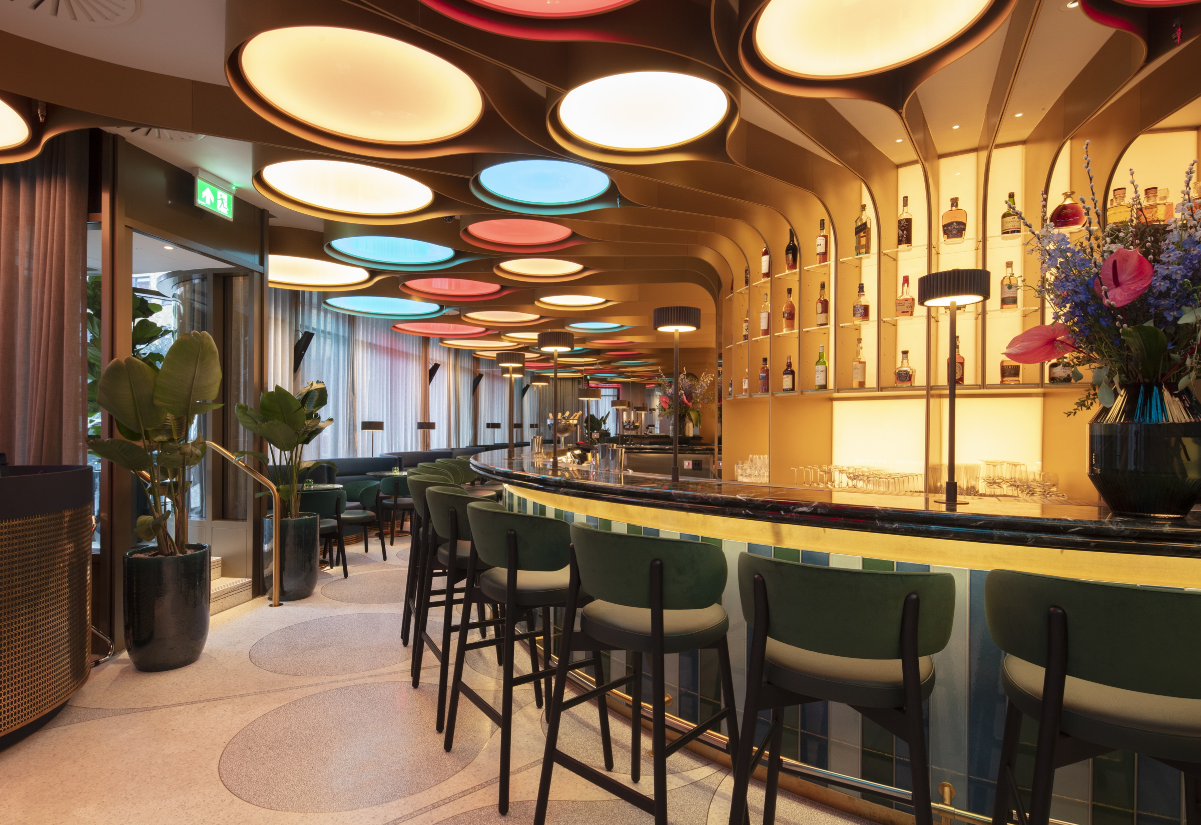 Modern bar area with vibrant lights for networking events and cocktail receptions.