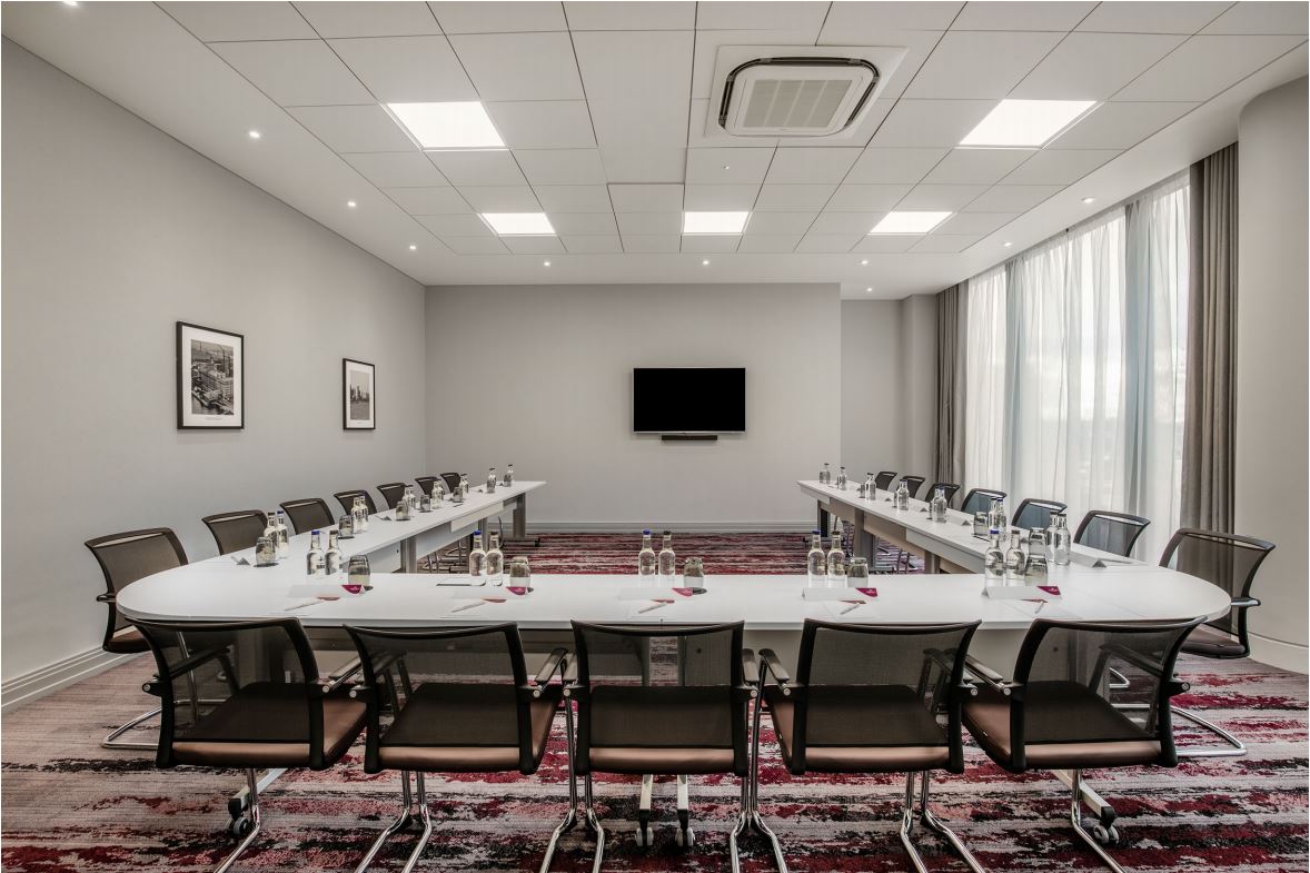 Victoria Suite at Crowne Plaza London Docklands, modern meeting room with U-shaped table setup.