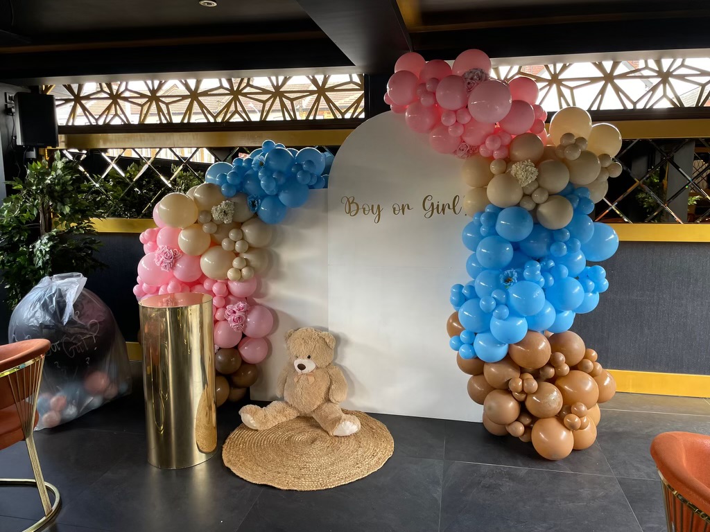 Pastel balloon arch at Central Restaurant for a gender reveal or baby shower event.