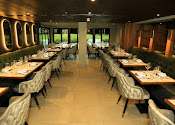 Stylish Tanishq Restaurant with elegant tables, perfect for corporate events and celebrations.