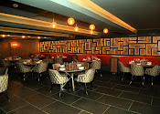 Stylish dining space at Tanishq Restaurant, perfect for intimate gatherings and corporate events.