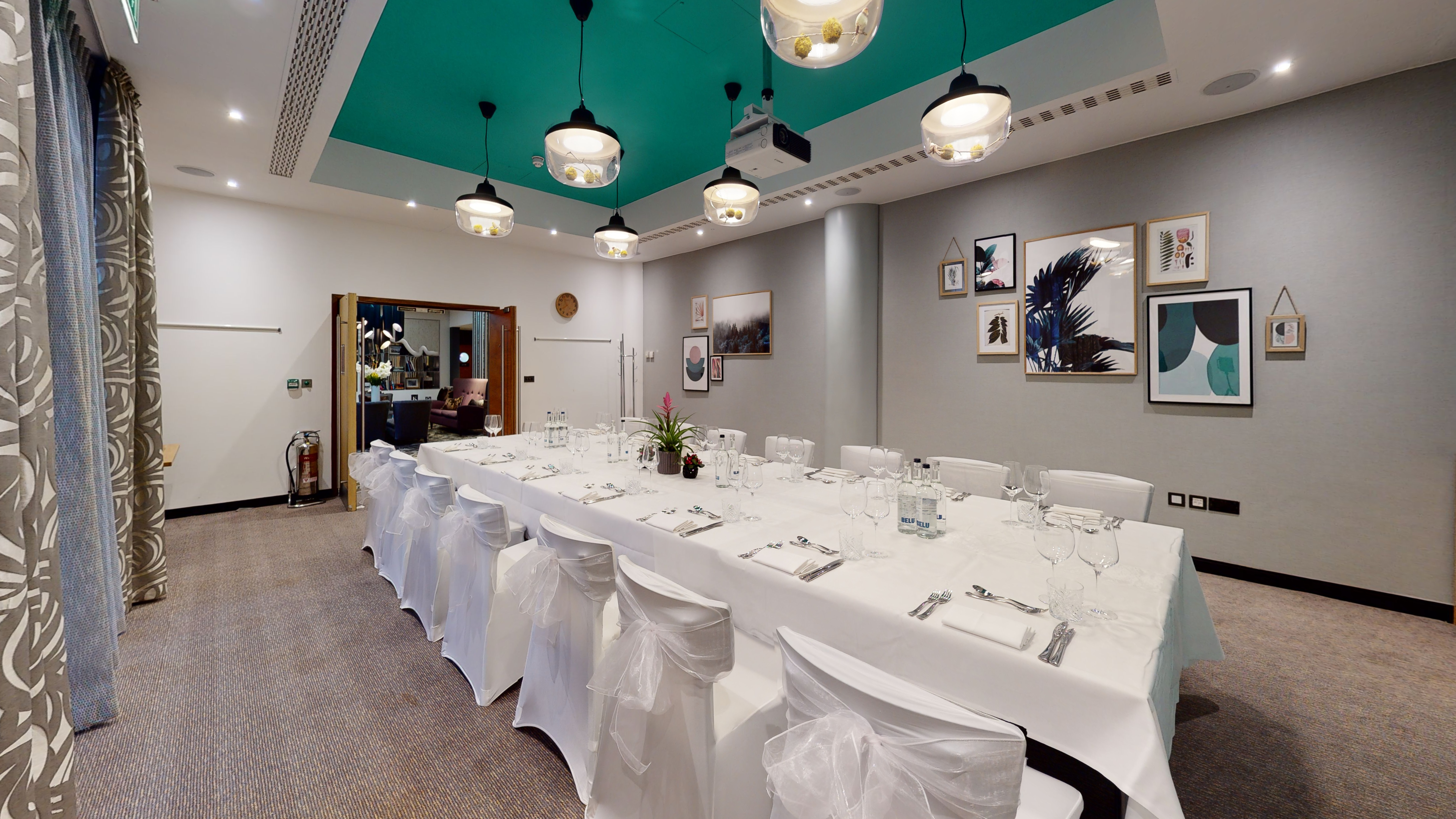 Garden Room at DoubleTree London Kensington, elegant meeting space with teal ceiling.
