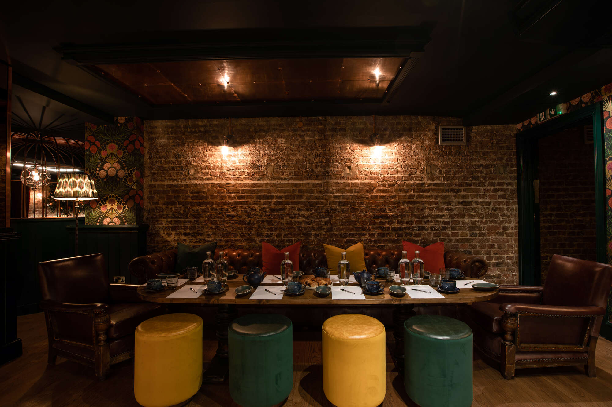 Stylish cocktail bar with vibrant seating, ideal for intimate meetings and networking events.