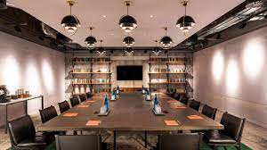 Modern meeting room at Bankside Hotel, featuring a long table for productive discussions.