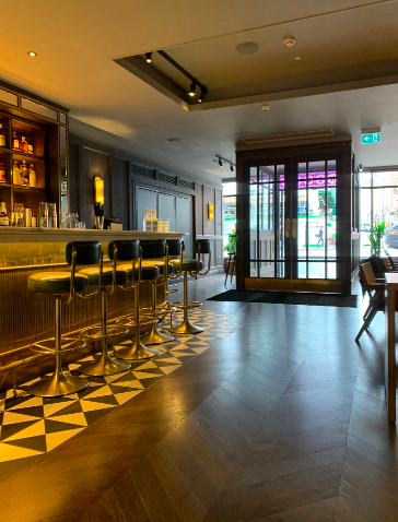 Stylish bar area with sleek seating, ideal for networking events and casual meetings.