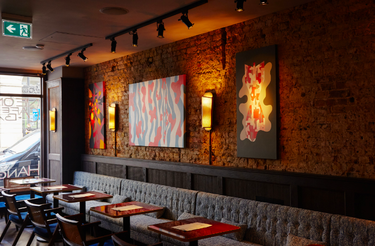 Stylish NEON194 bar with exposed brick, perfect for networking events and team meetings.