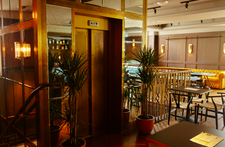 Stylish NEON194 bar with warm lighting, perfect for intimate meetings and events.