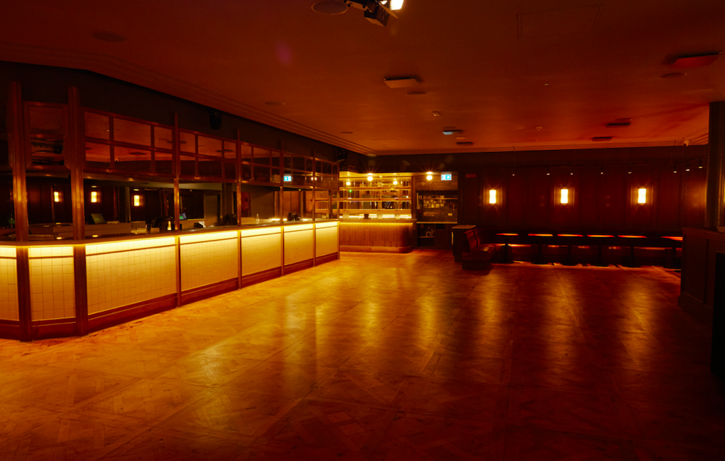 Versatile NEON194 Ballroom with sleek bar, ideal for cocktail receptions and networking events.