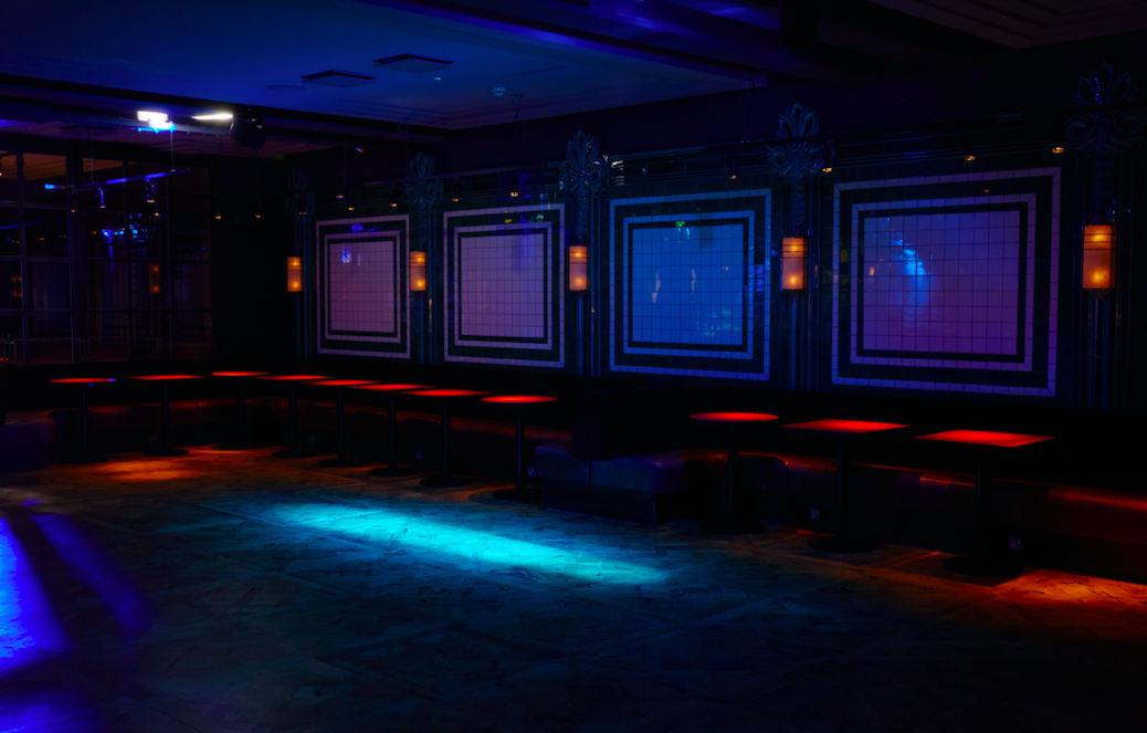 Stylish event space with ambient lighting, ideal for parties and networking events.