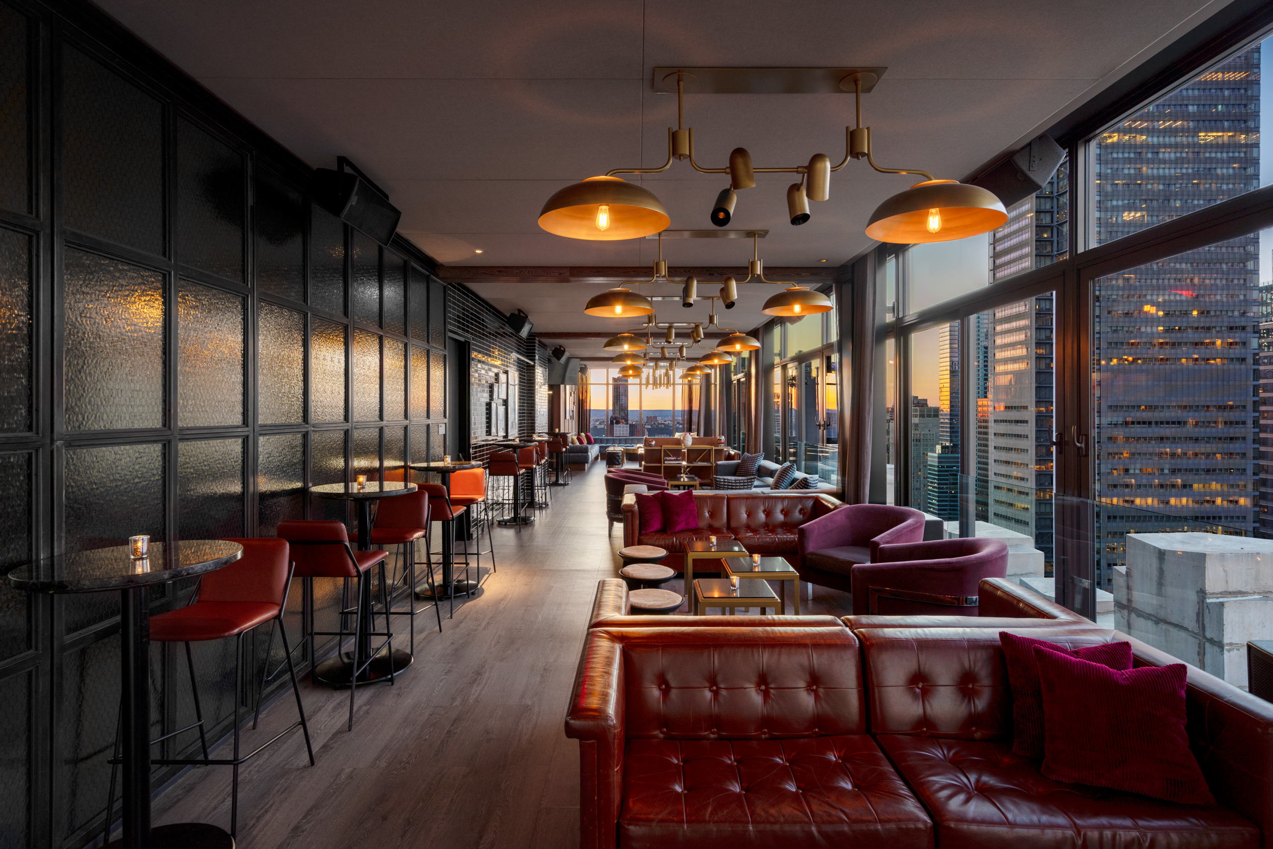 Stylish rooftop lounge with plush seating and city views, perfect for events and receptions.