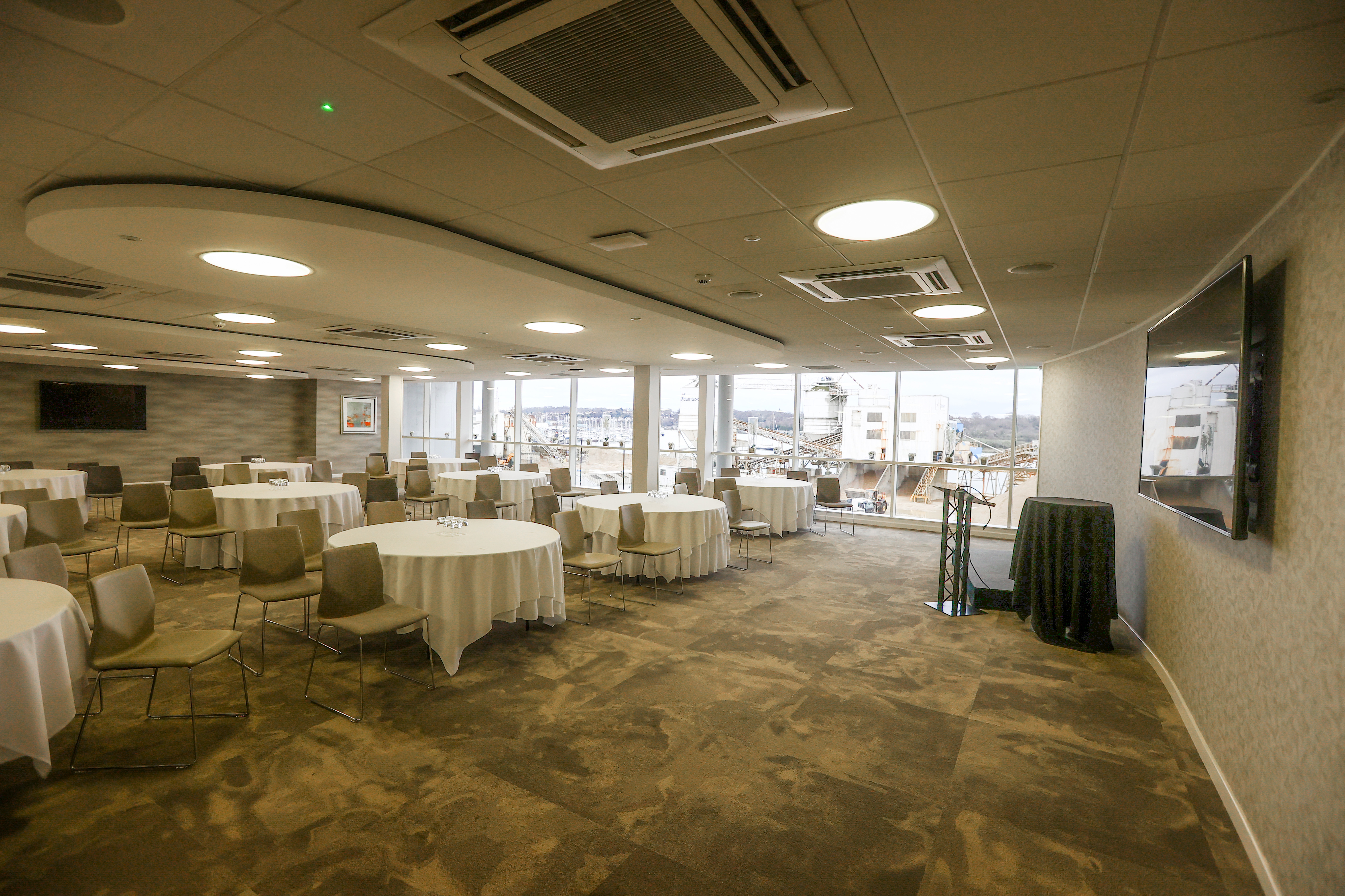 Markus Liebherr Lounge at Southampton FC, versatile event space with round tables.