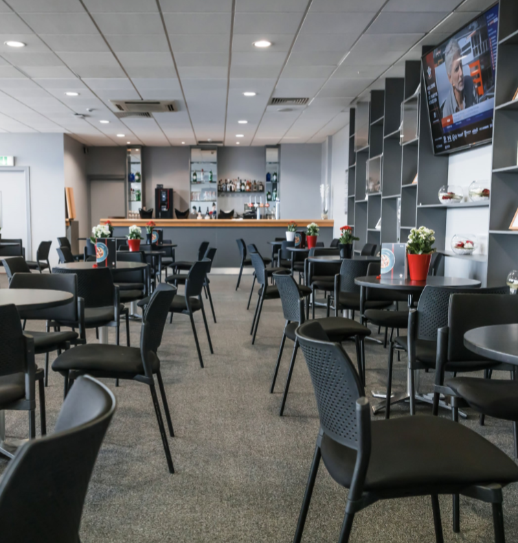 Matthew Le Tissier at Southampton FC event space, modern furnishings for networking.