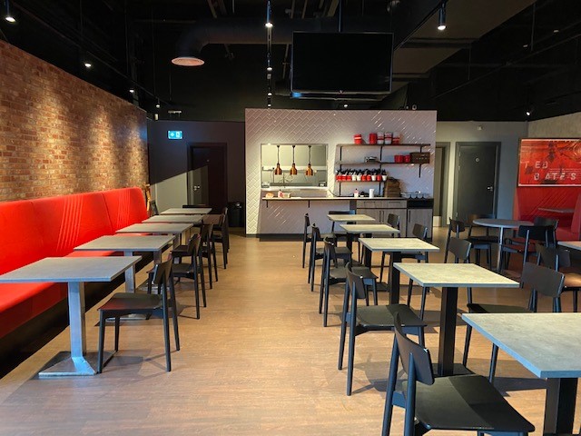 Gasworks Kitchen event space at Southampton FC, modern decor, ideal for meetings and networking.