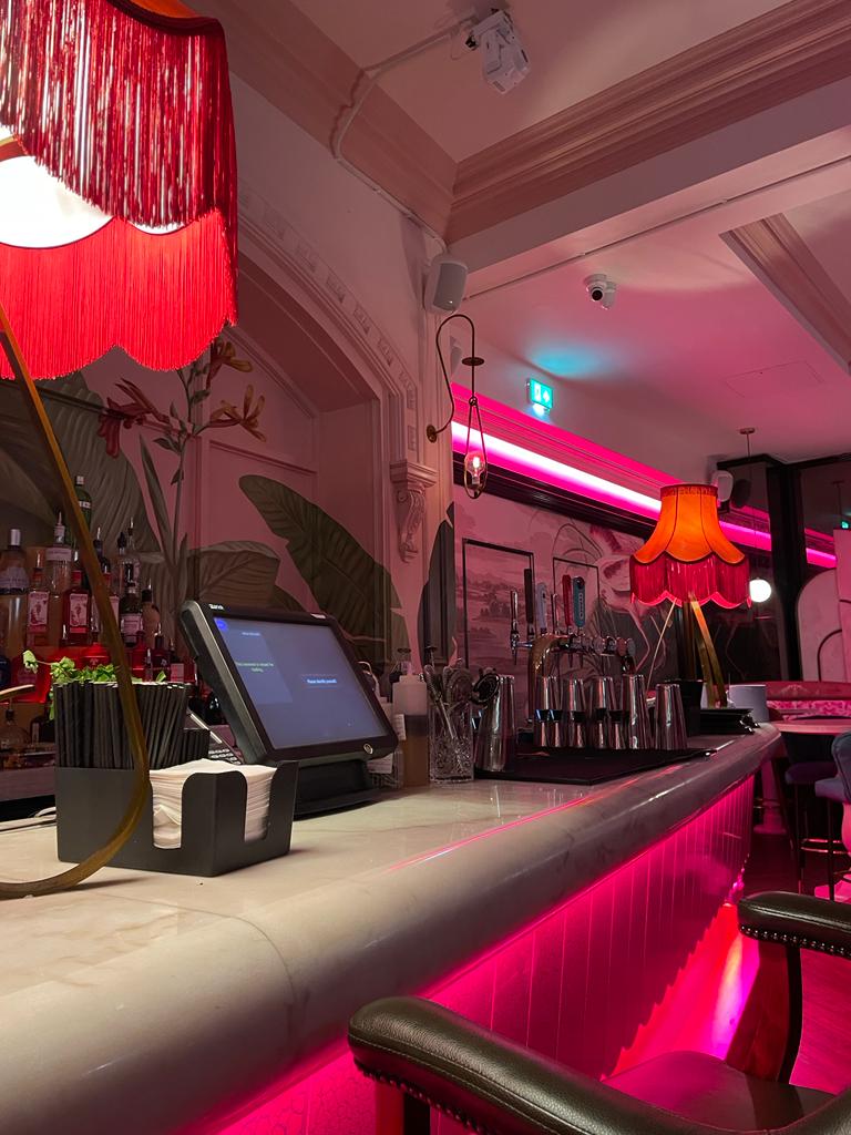 Stylish bar at PINK in Impossible York, perfect for intimate gatherings and networking events.