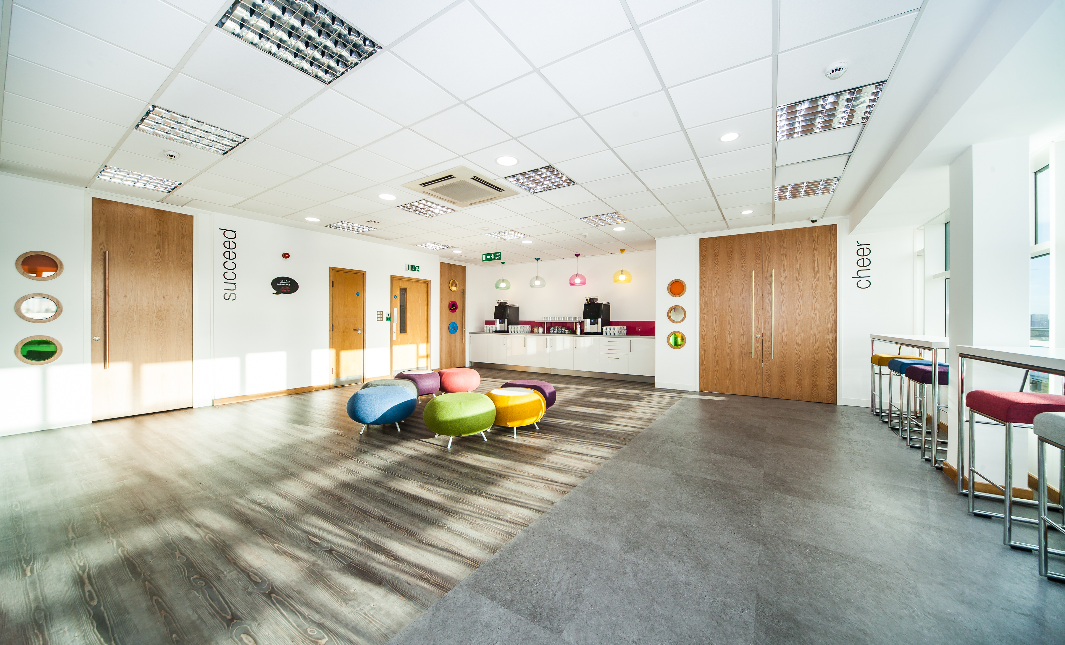 Modern reception area with colorful seating for meetings and events in Leeds.