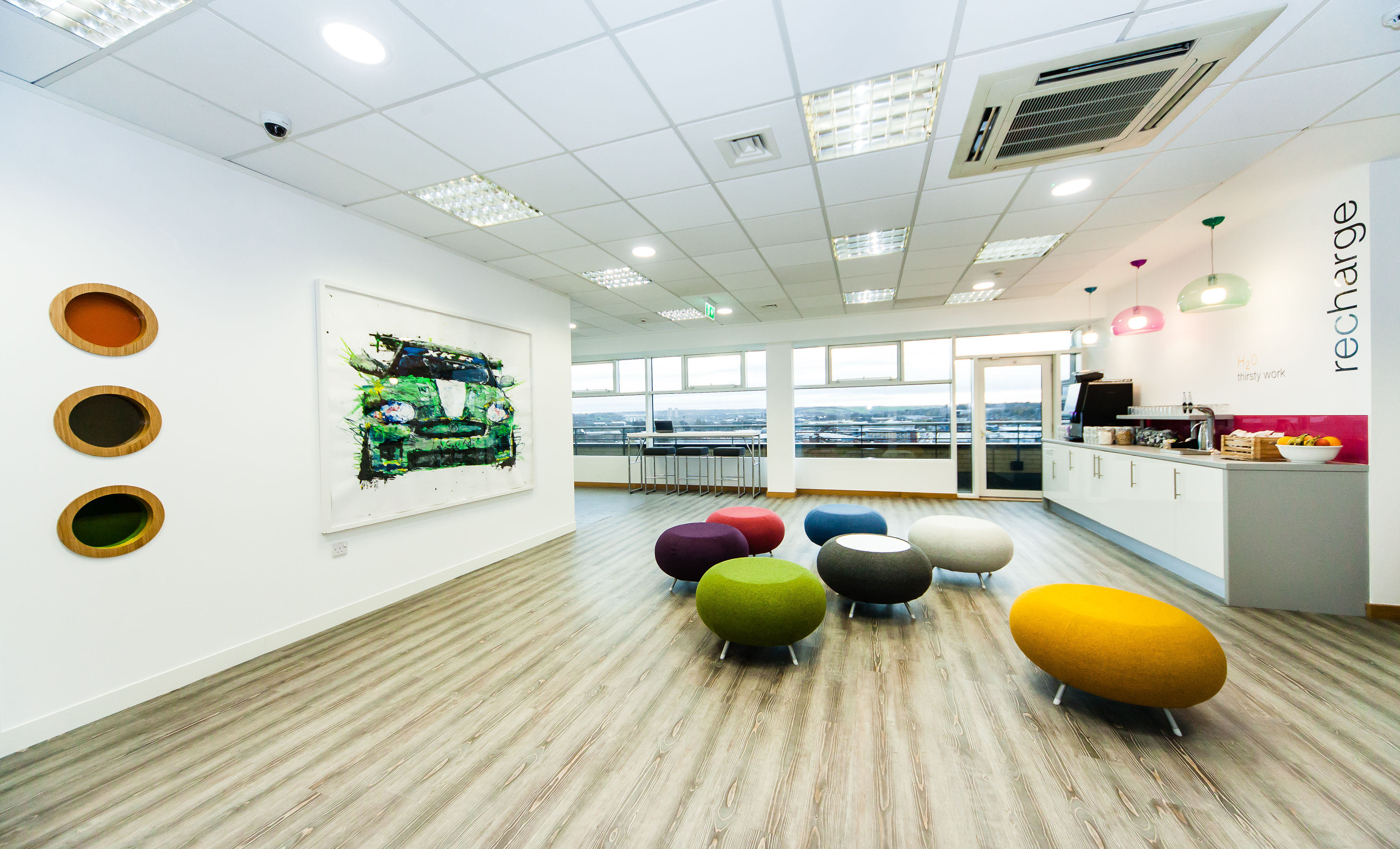 Modern meeting space in Leeds with vibrant seating for workshops and team-building events.