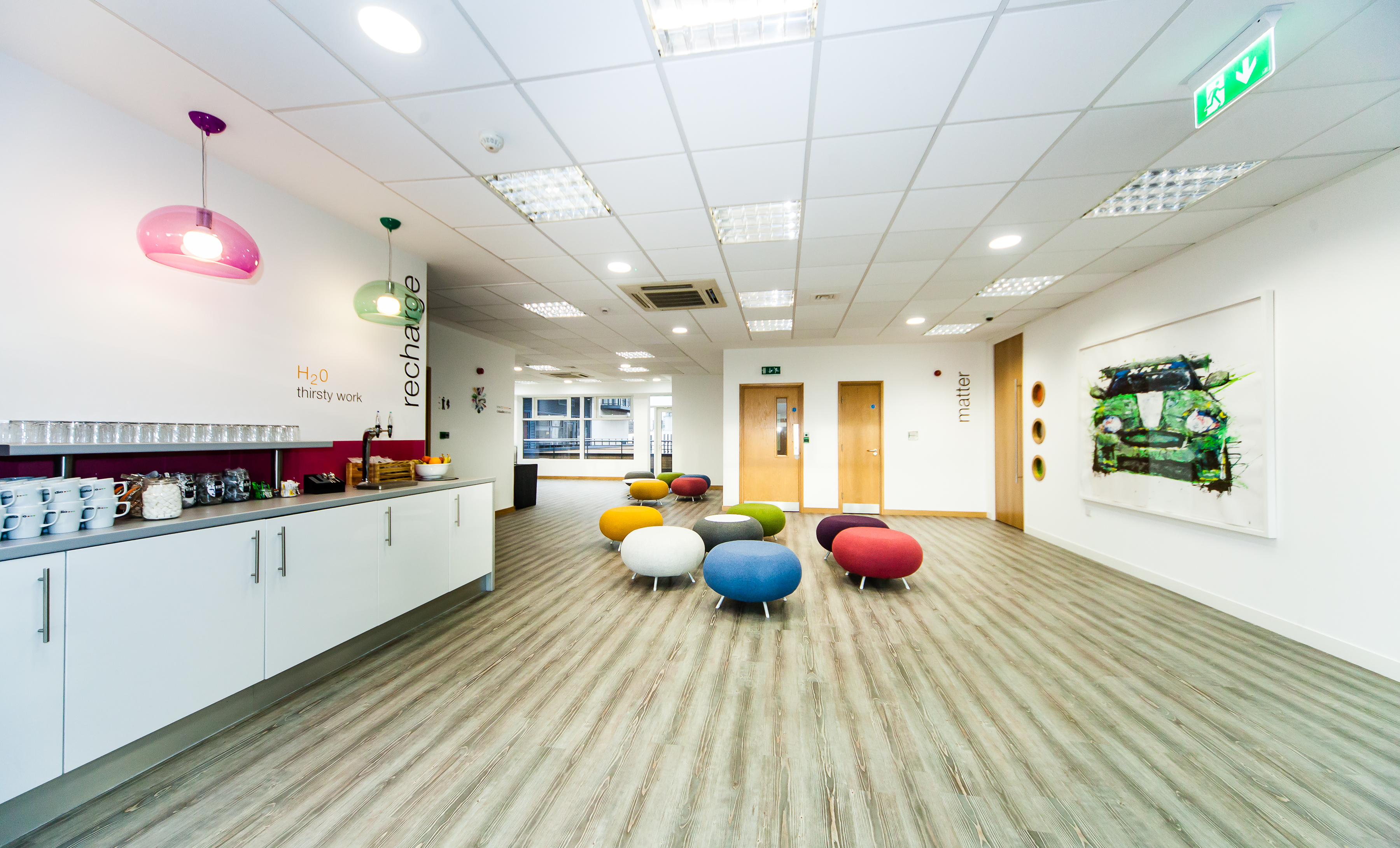 Modern meeting space in Leeds with colorful seating for workshops and team meetings.