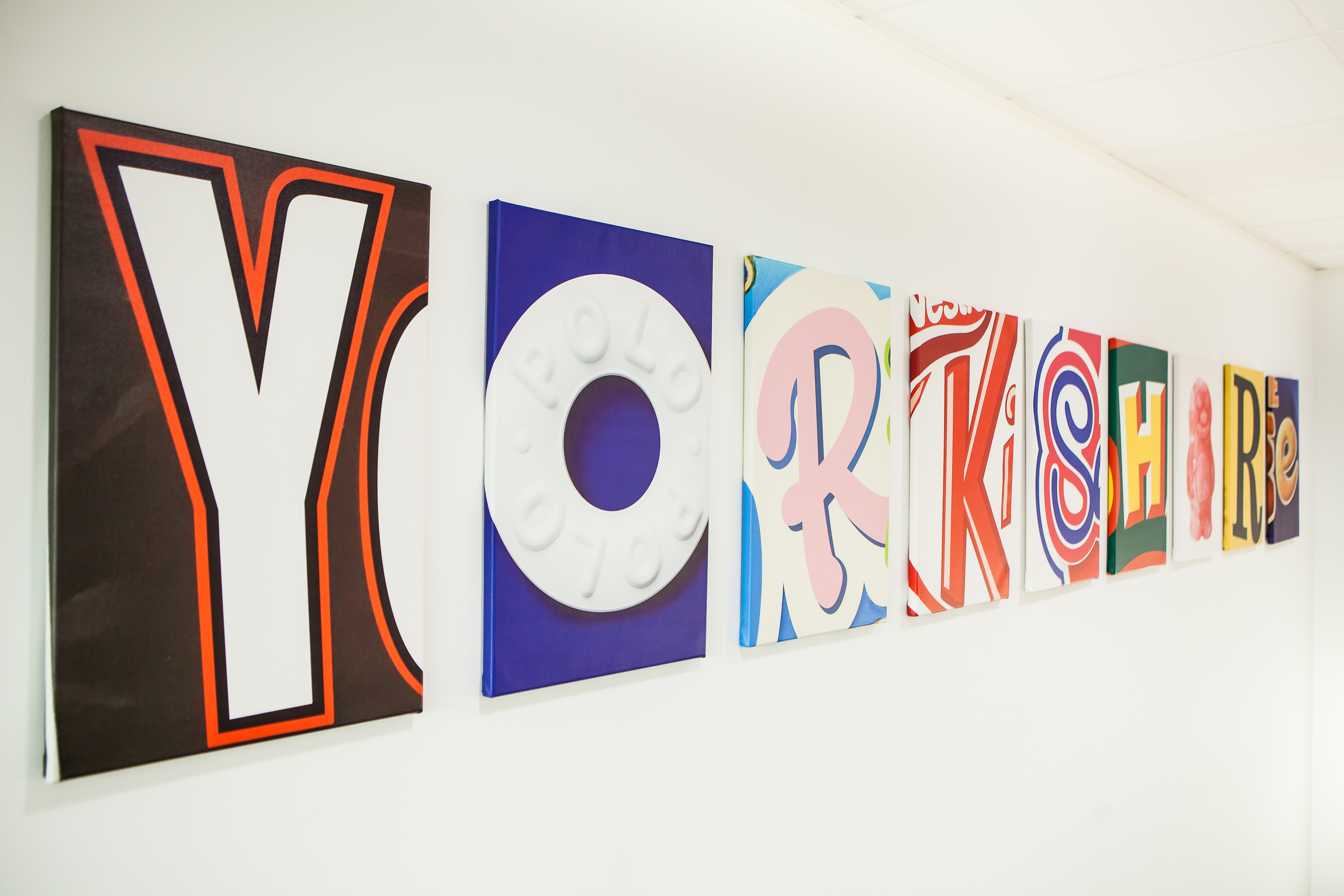 Colorful "YORKSHIRE" letters at Succeed in thestudio Leeds for vibrant event branding.