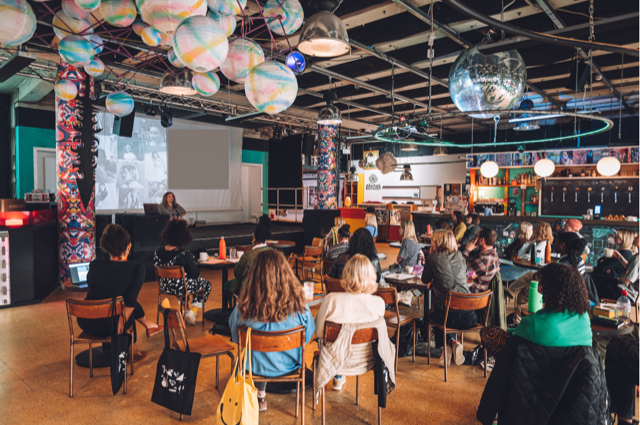 Vibrant event space with colorful decor for workshops and conferences at Strange Brew.