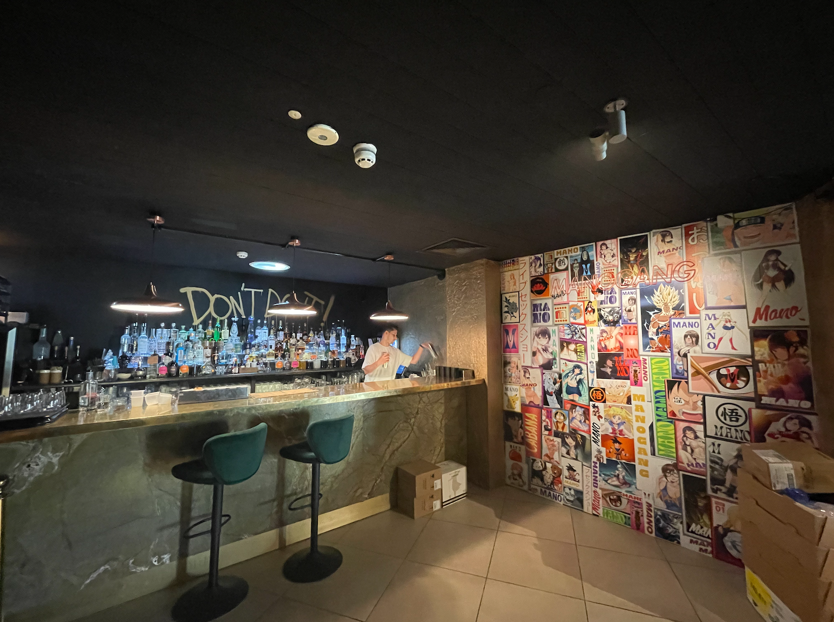 Stylish bar area with vintage posters, perfect for networking events and cocktail receptions.