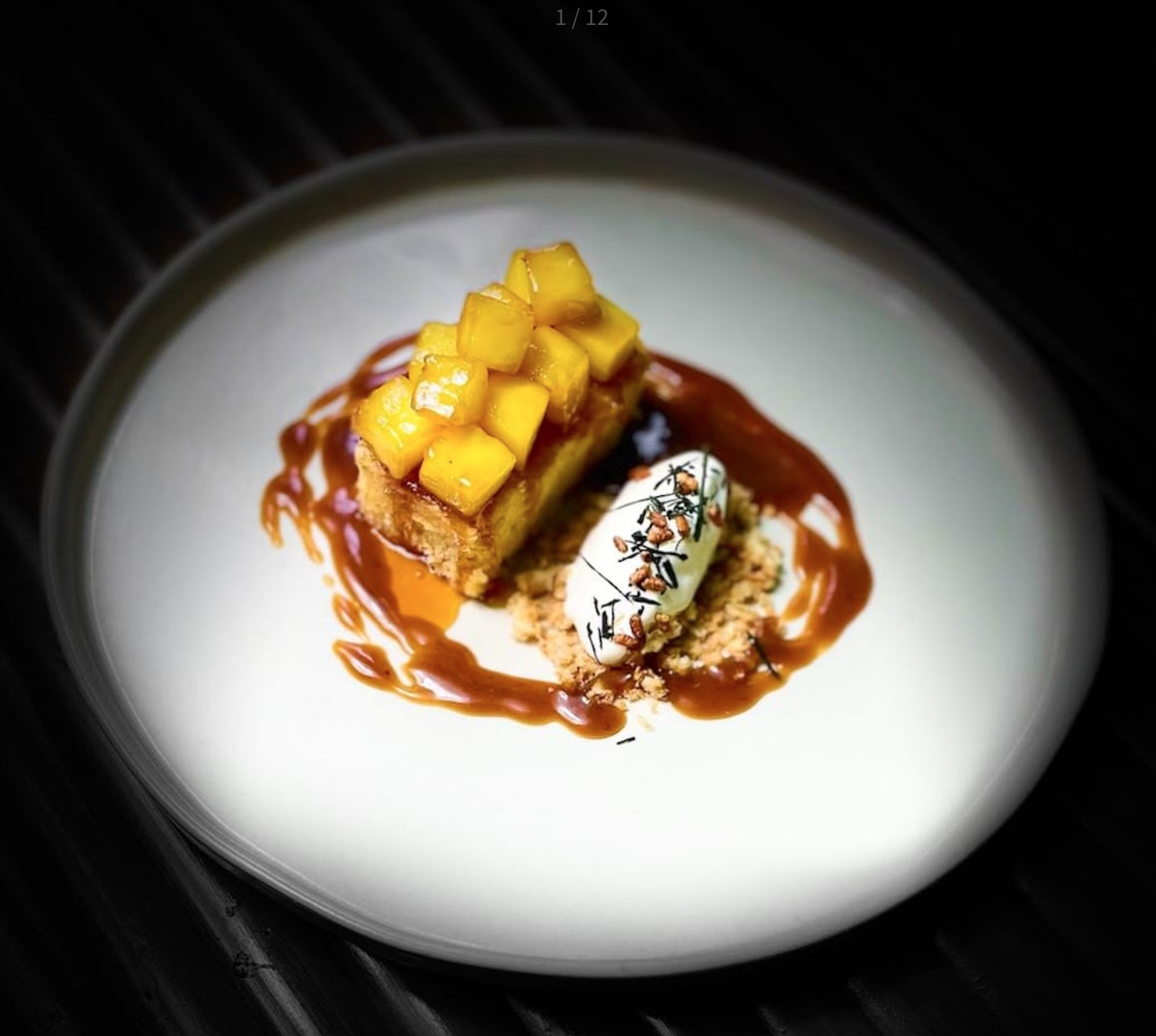 Plated dessert with mango, ice cream, and caramel for upscale events and gatherings.