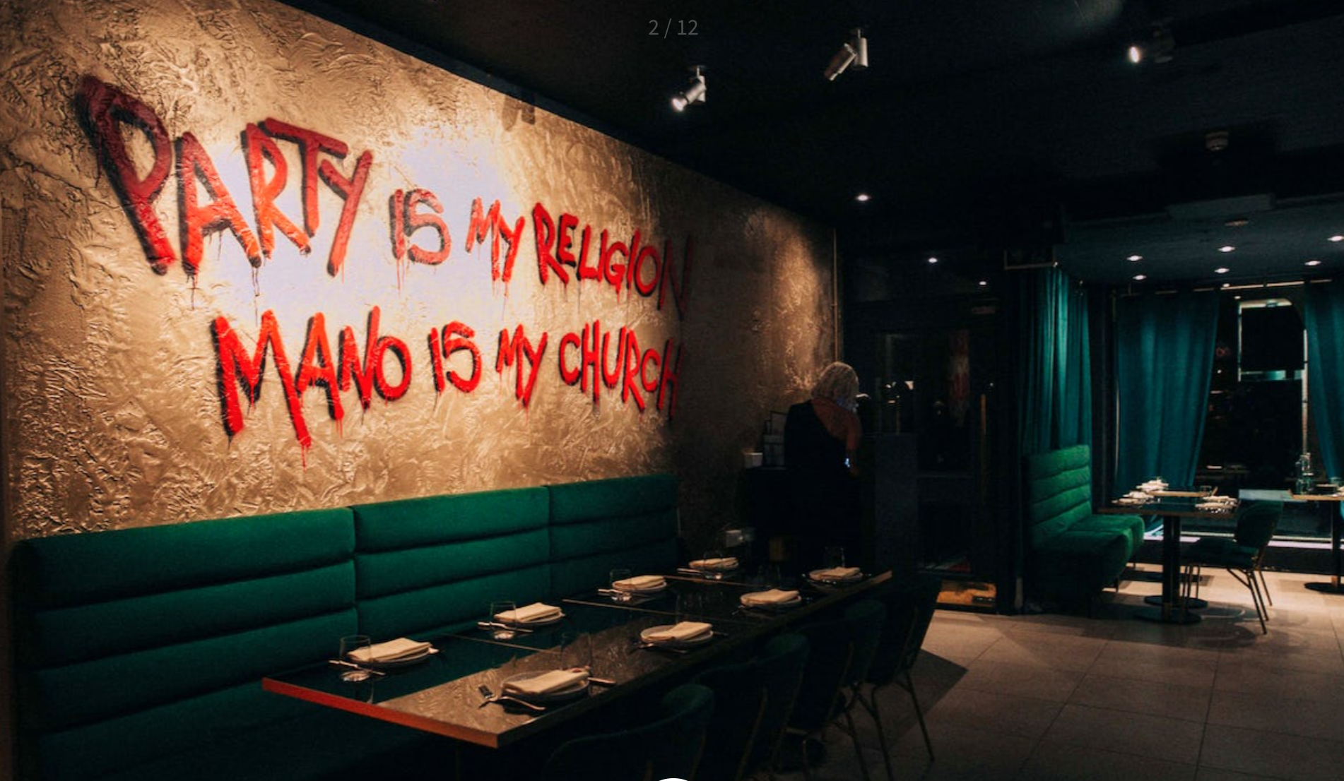 Vibrant event space with artistic wall, ideal for parties and gatherings.