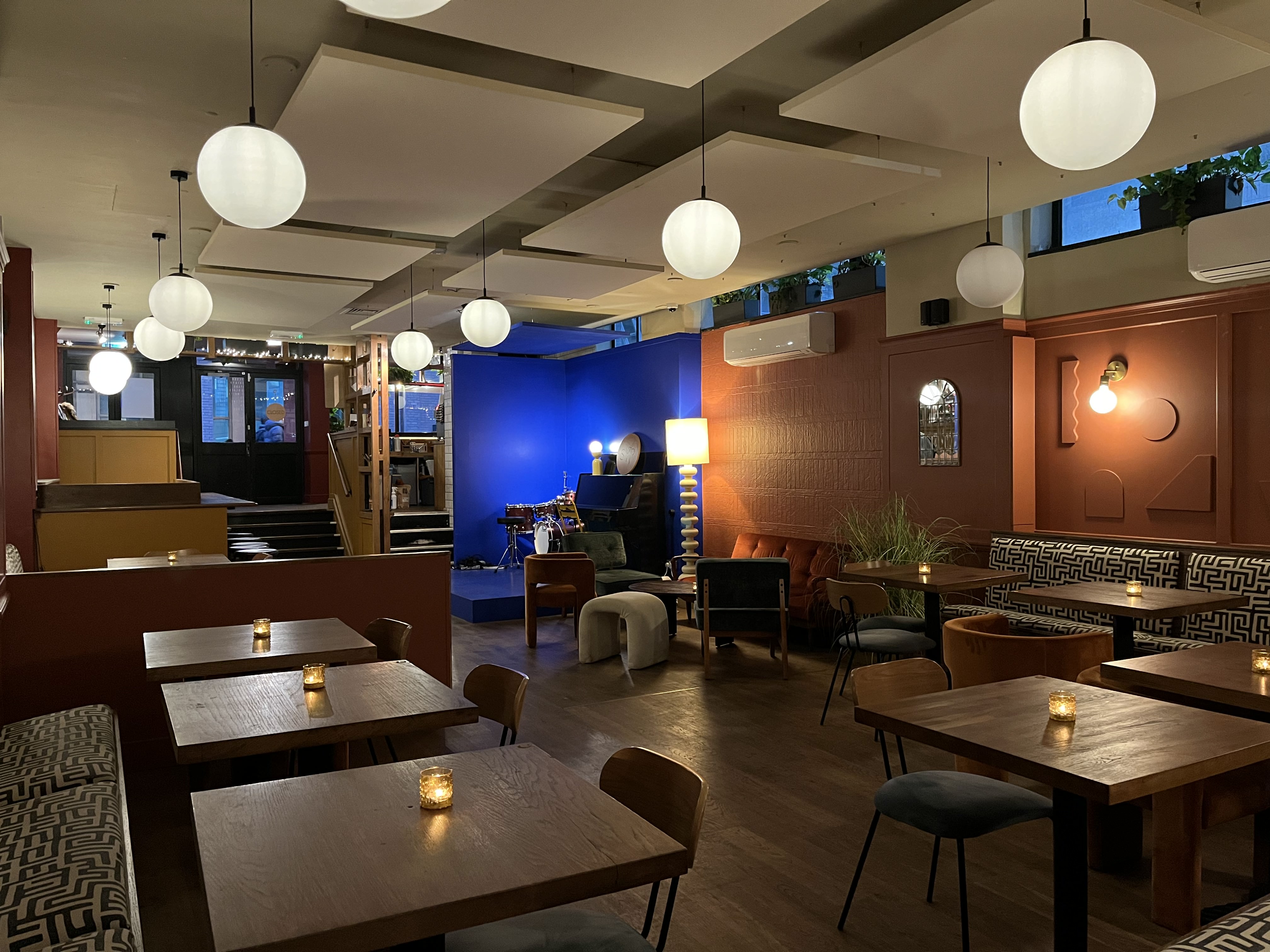 Stylish event space with blue accent wall, perfect for networking and gatherings.