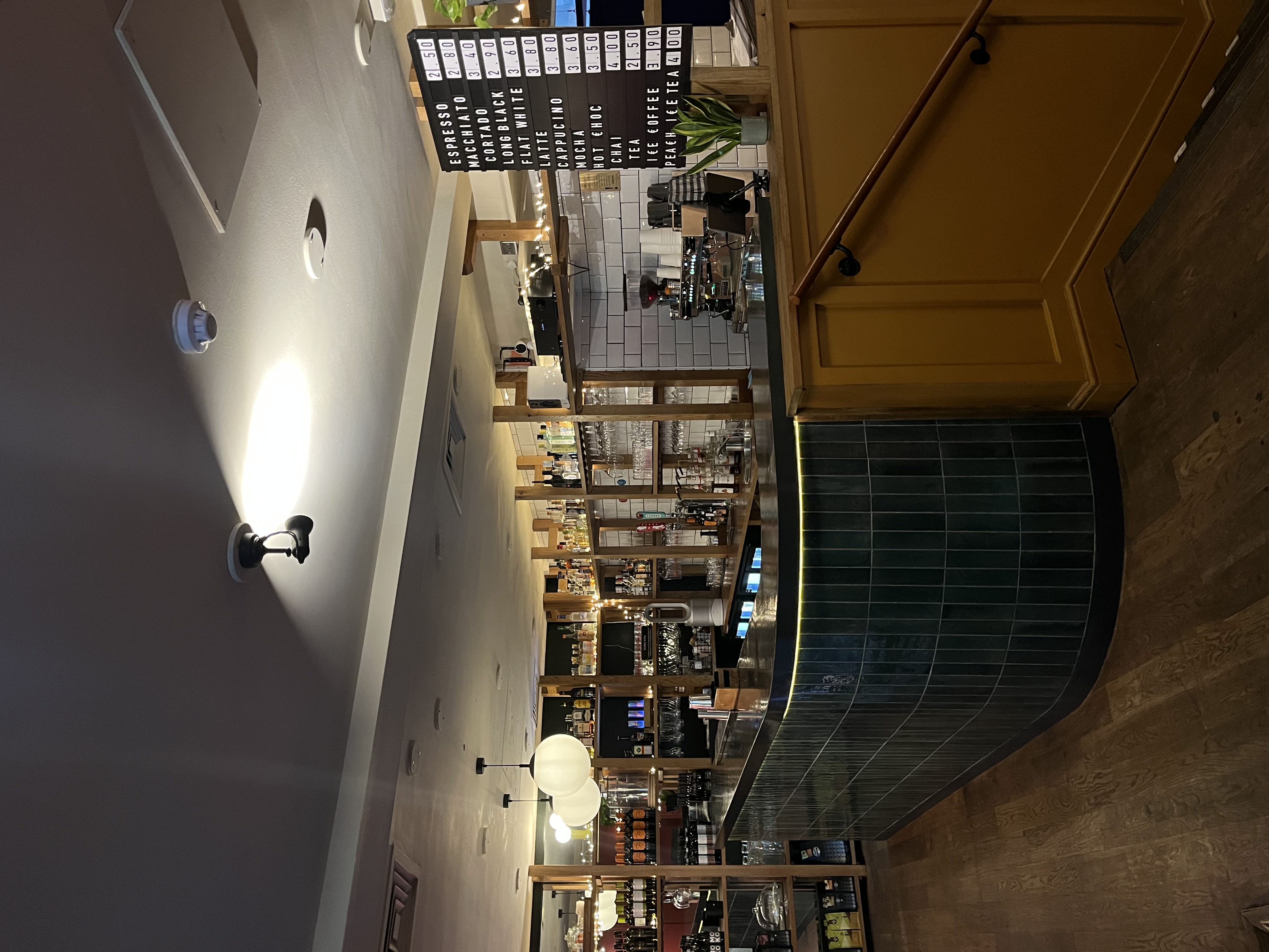 Stylish café bar with sleek counter, ideal for networking and team-building events.