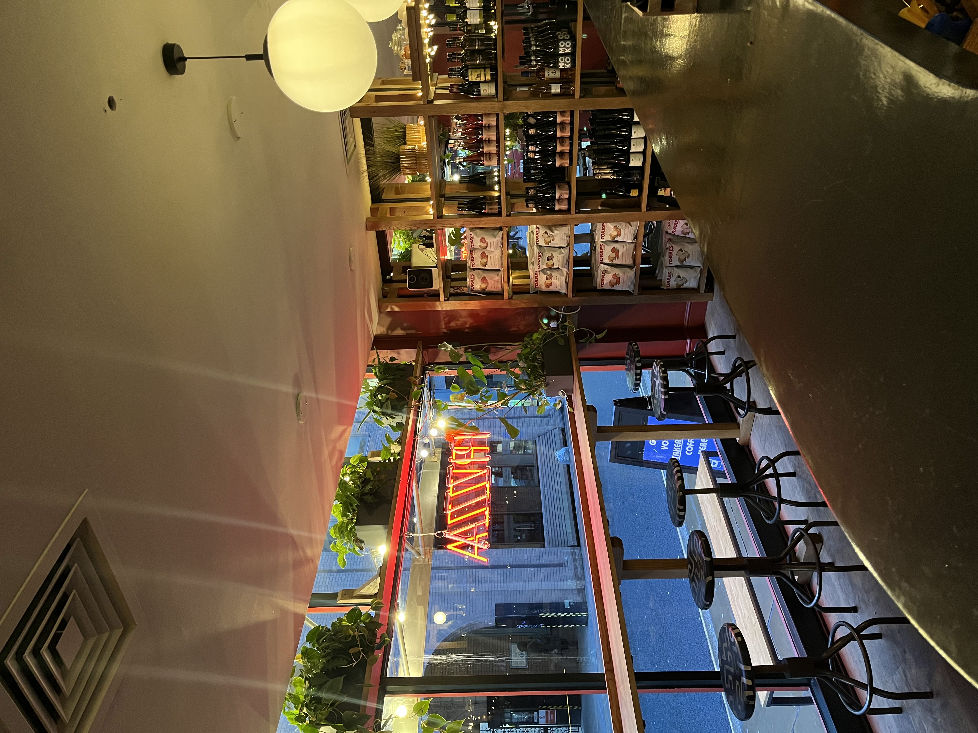 Cozy venue with warm lighting, perfect for wine tastings and networking events.