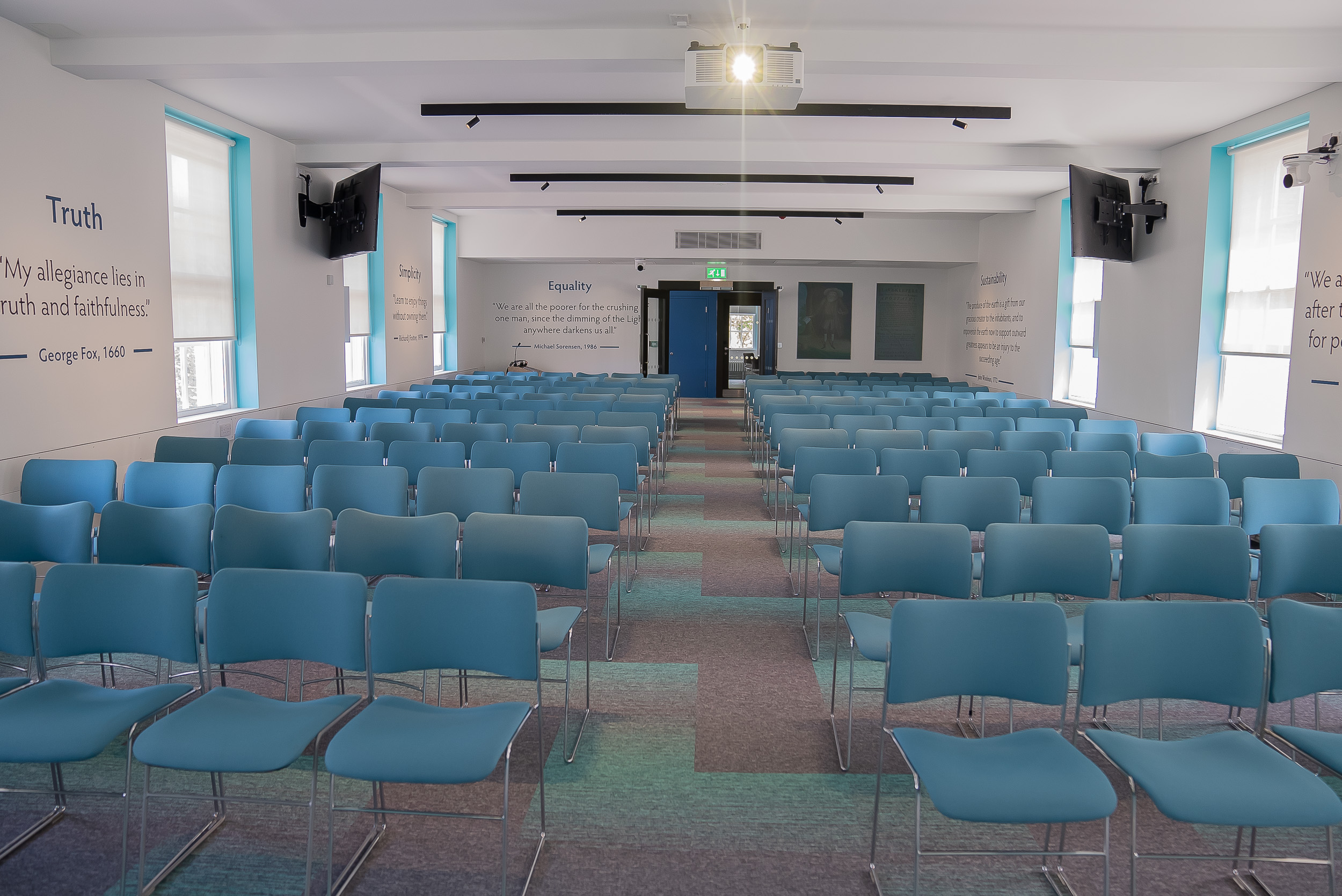 "Event space with blue chairs for a workshop or conference at Friends House."